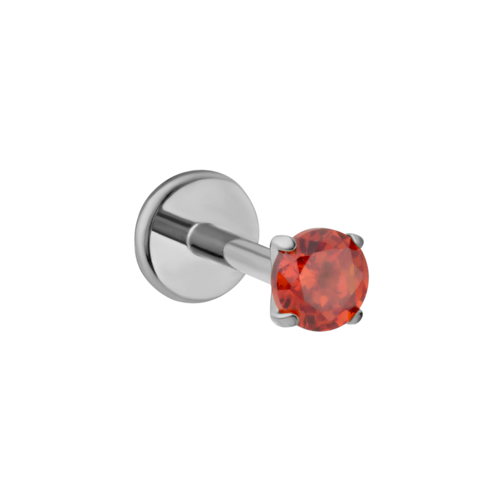 A silver-toned labret piercing stud featuring a round-cut dark orange gemstone in a four-prong setting, shown against a plain white background.