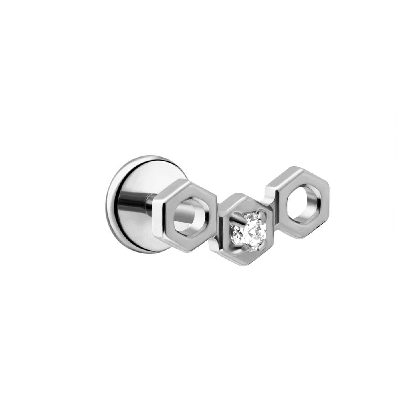 Close up of a hexagon shaped flat back stud earring made from 18k gold-plated ASTM F136 implant-grade titanium, with a clear zirconia stone, against a white background.