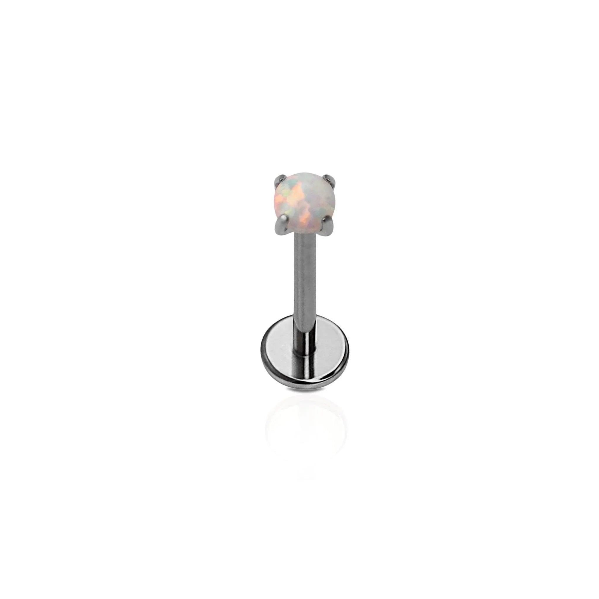 A single dark silver-colored titanium flat back stud with a prong-set synthetic opal.
