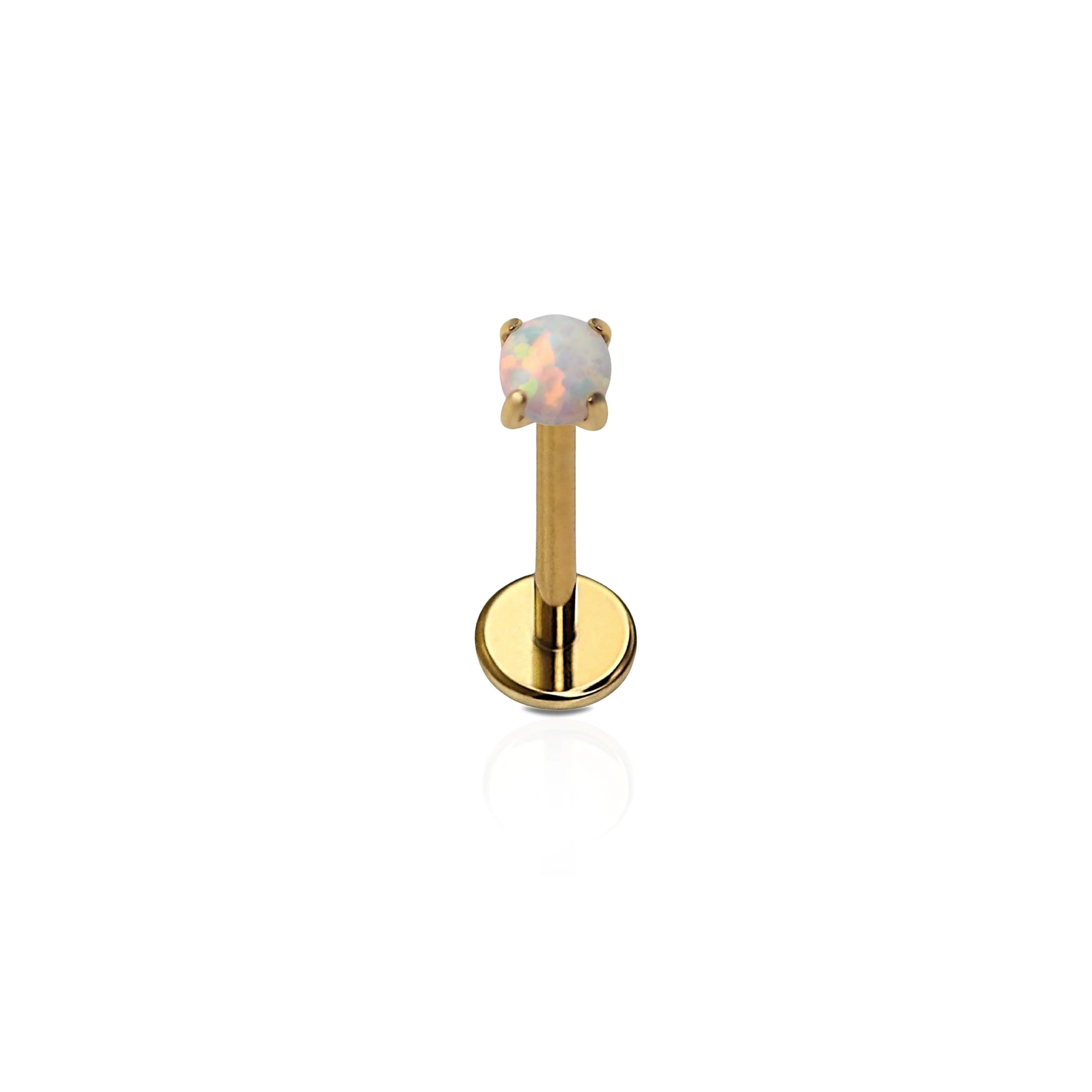 A single gold-colored titanium flat back stud with a prong-set synthetic opal. 