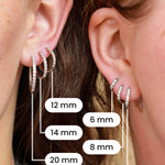 Comparison of 6 different sizes of silver hoops on the ears of 2 models.