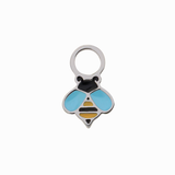 A close up of a bumblebee shaped hoop charm with yellow and black enamel and titanium metal on a white background