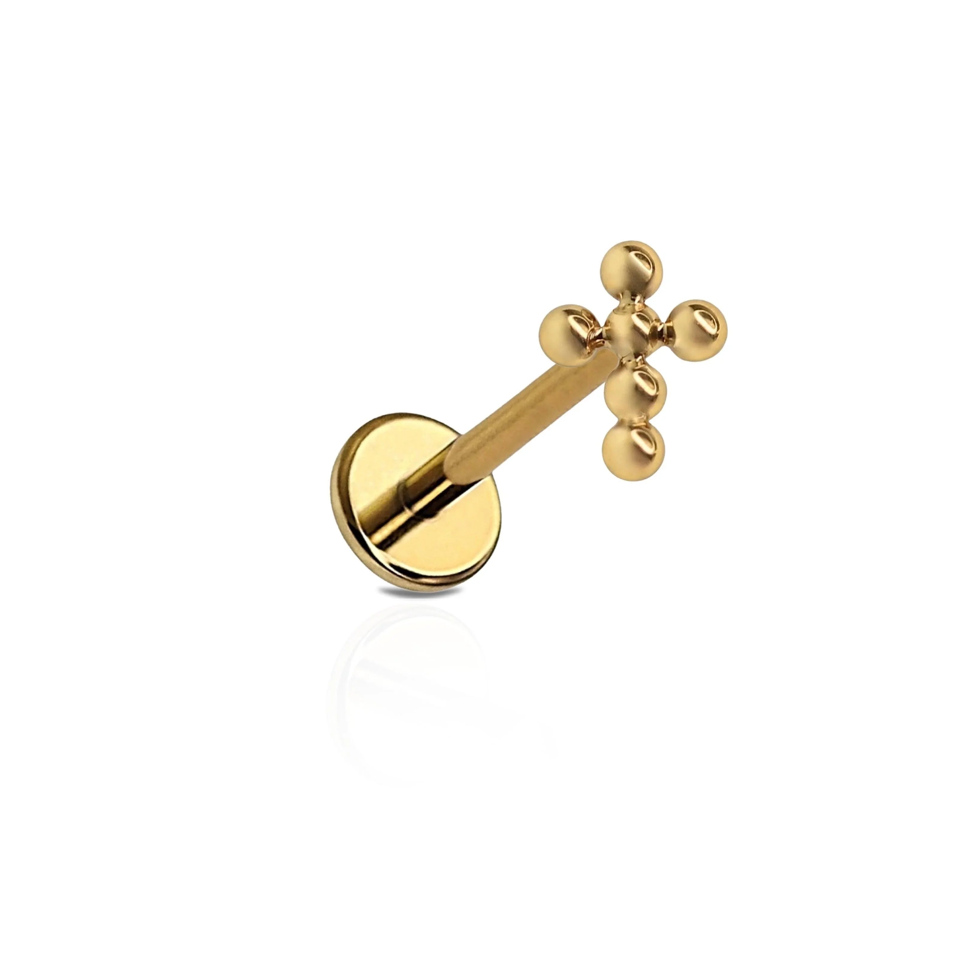 A single ASTM F136 implant grade titanium flat back stud with a cross design, plated in 18K Gold and Titanium Silver colors.