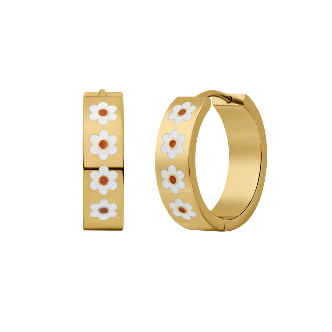 A close up of a hoop earring made from 18k gold-plated titanium metal, with a line enamel daisy in white and yellow decorating the hoop on a white background