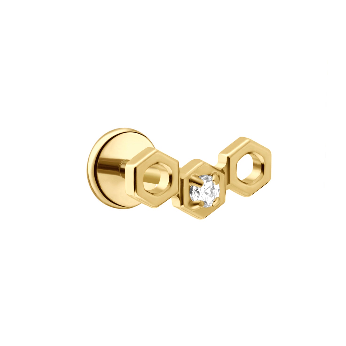 Close up of a hexagon shaped flat back stud earring made from 18k gold-plated ASTM F136 implant-grade titanium, with a clear zirconia stone, against a white background. 