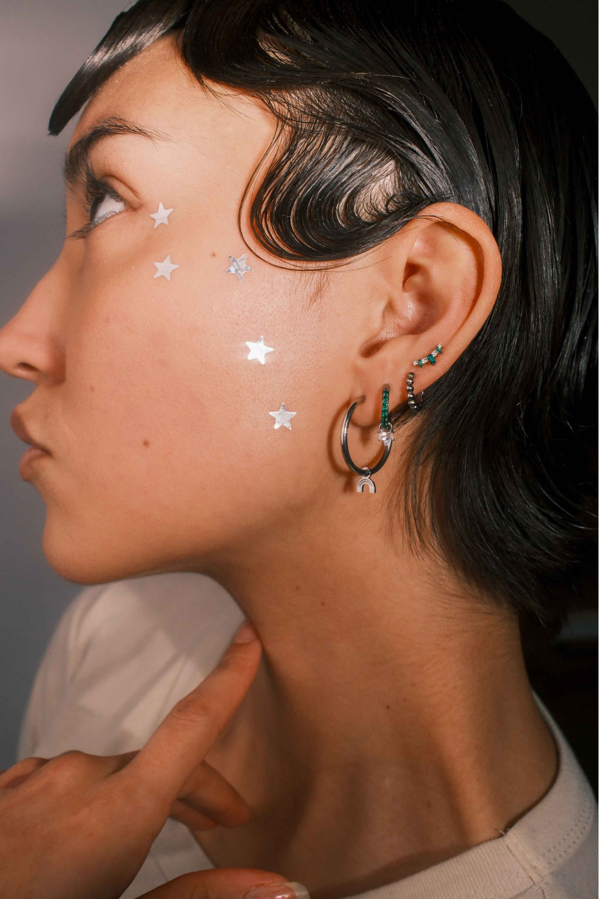 Close-up of a person wearing earrings 
