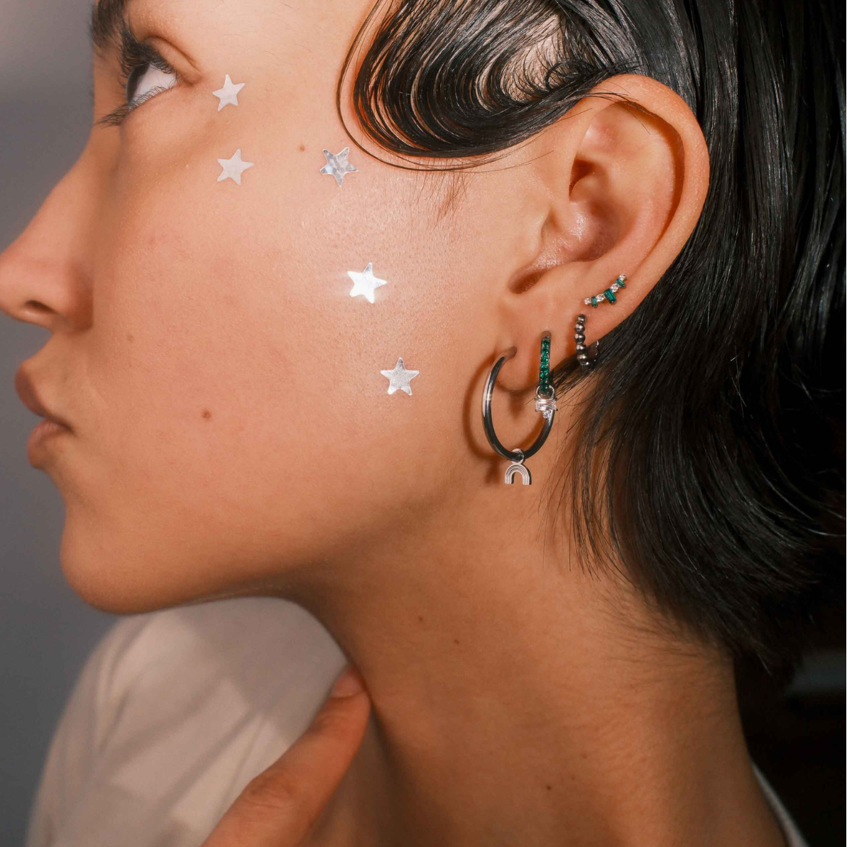 Close-up of a person wearing earrings 