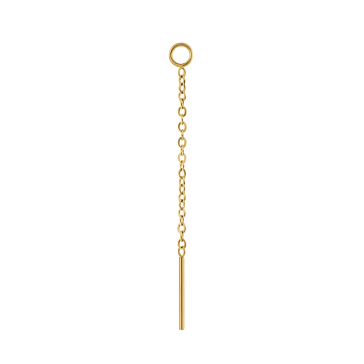 Close up on an earring accessory that features a thin chain with a small ring at one end, and a small rod at the other. The ring is is designed to link with another earring, like a hoop or a flat back stud, and the chain and rod are designed to thread through another peircing, or hang like a charm. Made from 316L Surgical steel and finished with 18k Gold PVD plating. 
