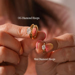 Size comparison of OG Diamond Hoops and Mini Diamond Hoops on a blurred background
