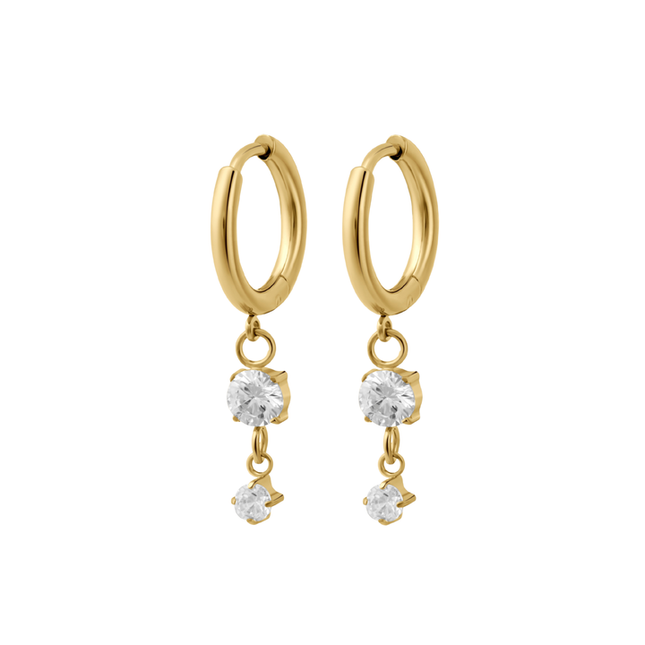 Gold hoop earrings with clear CZ stones dangling on a white background