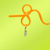 Orange straw with a silver 3D Lime wedge charm on a yellow-green background