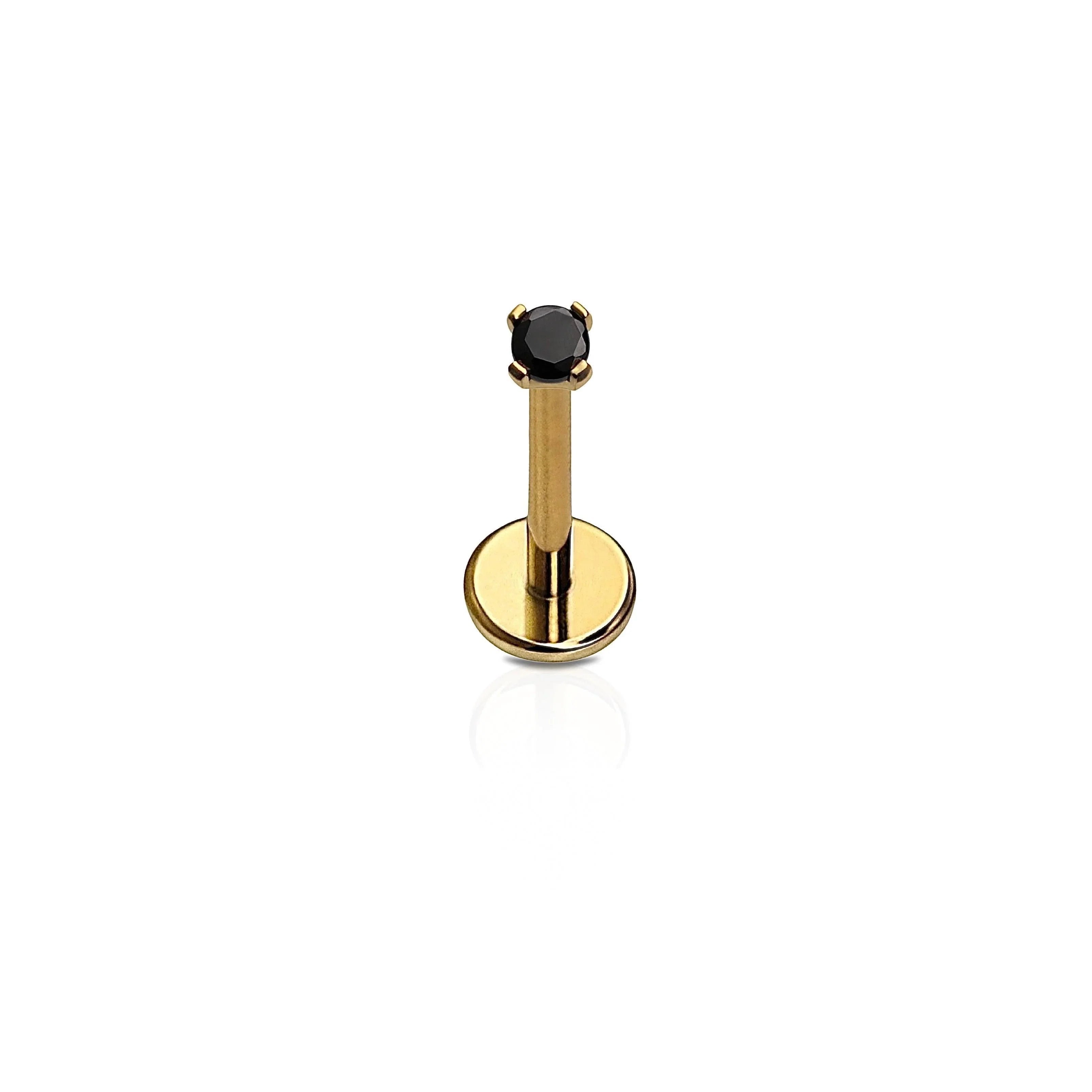 A single flat back stud with a black gem, attached to a gold-colored titanium post, against a white background.