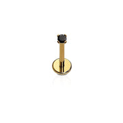 A single flat back stud with a black gem, attached to a gold-colored titanium post, against a white background.