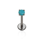 Polished titanium flat back stud with a prong-set turquoise-colored CZ on a white background.