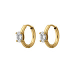 Gold hoop earrings with clear gemstones on a white background