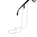 Silver eyeglass chain attached to black sunglasses on a white background