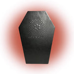 Black leather coffin-shaped product with a floral design on a pink gradient background