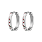 Silver hoop earrings with red rosebud patterns on a white background