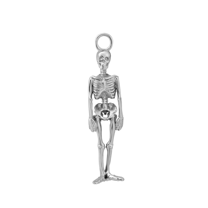 Silver skeleton charm on a white background