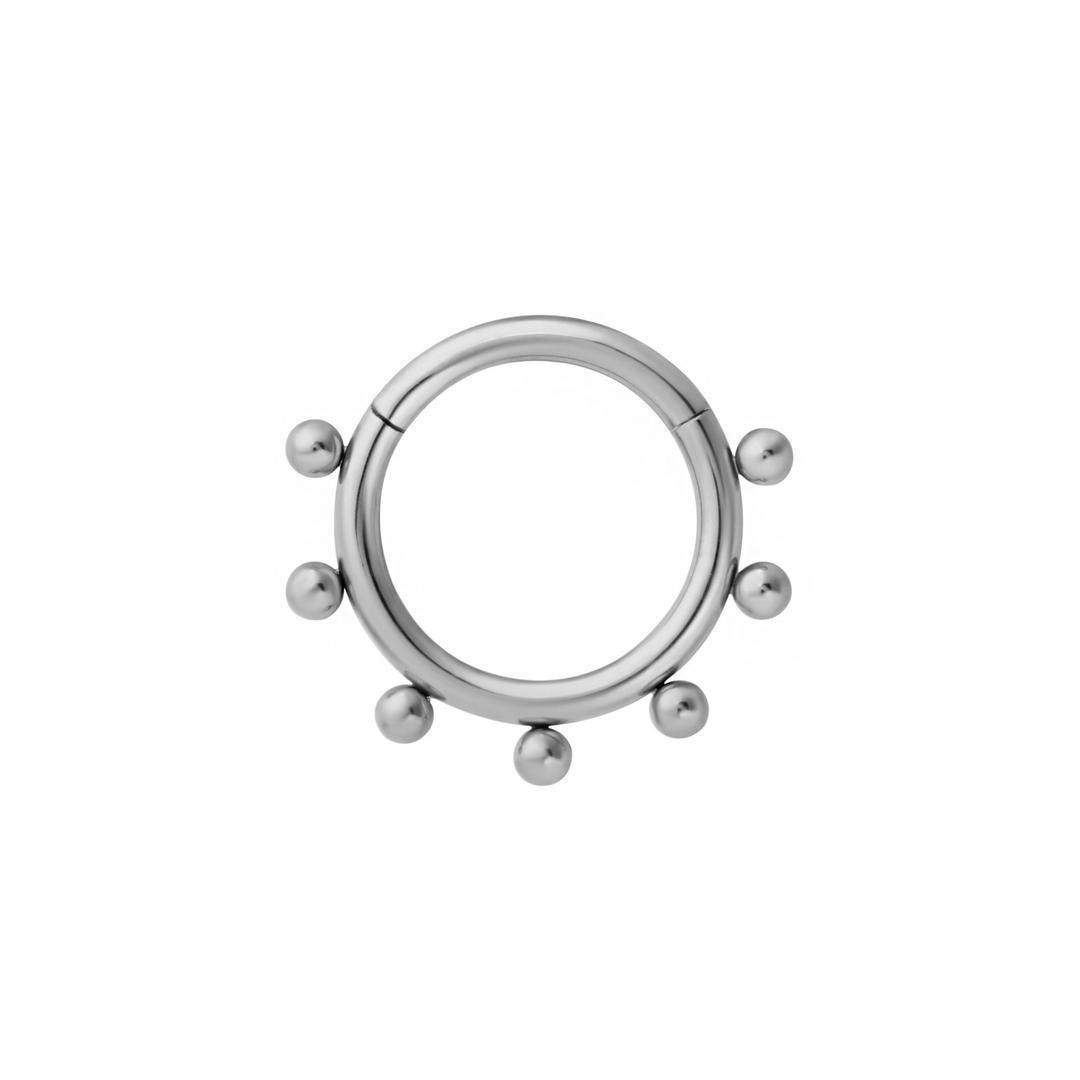 Close up of a clicker-style hoop featuring a series of round metal details that radiate from the main hoop. Designed for Daith or Septum piercings, and made from ASTM F136 Implant-Grade Titanium.