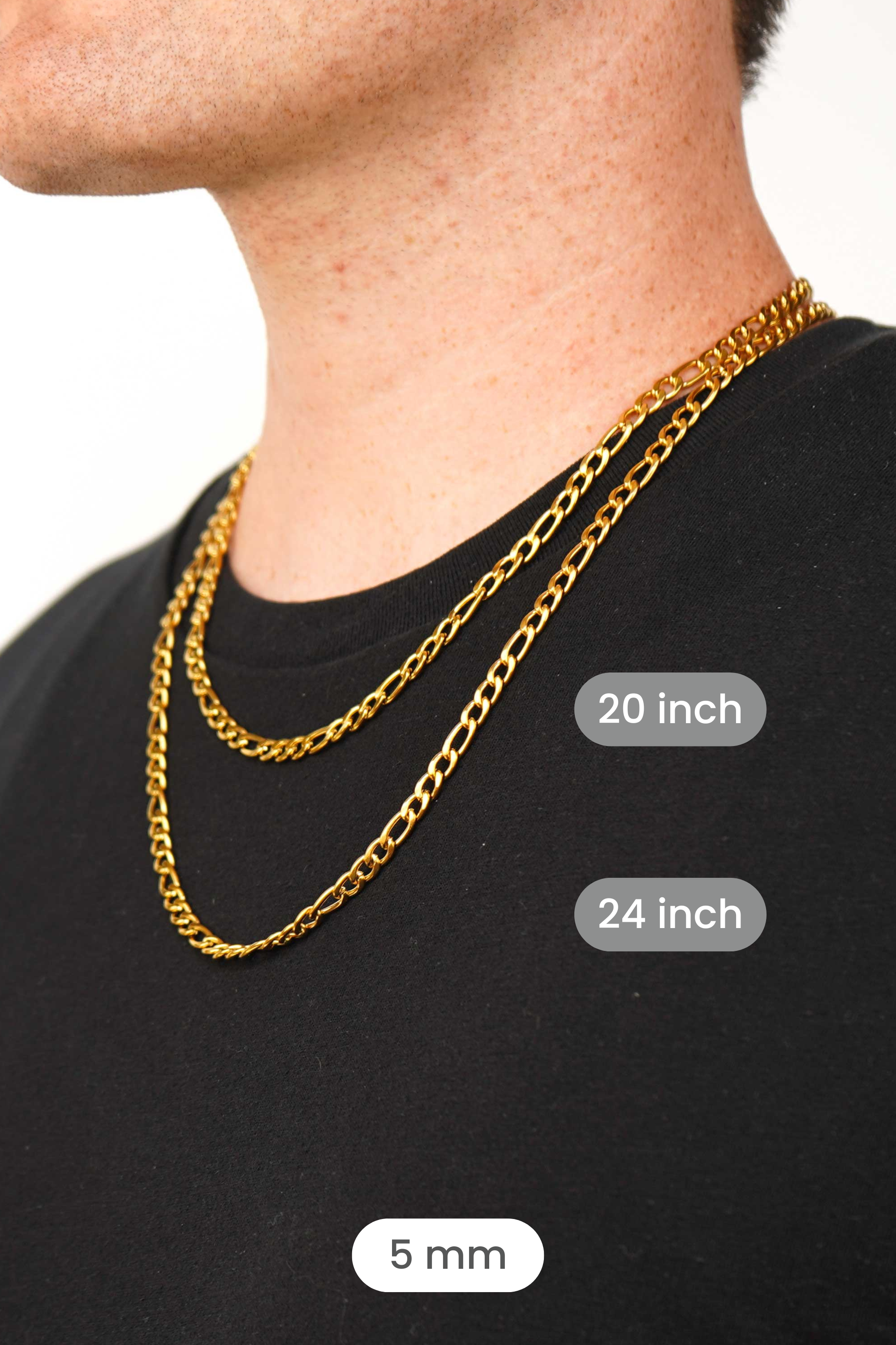 A close-up of a man's neck and upper chest wearing two gold chain necklaces layered over a black t-shirt. White text labels indicate the chain lengths: 20 inch, 24 inch, and 5 mm.