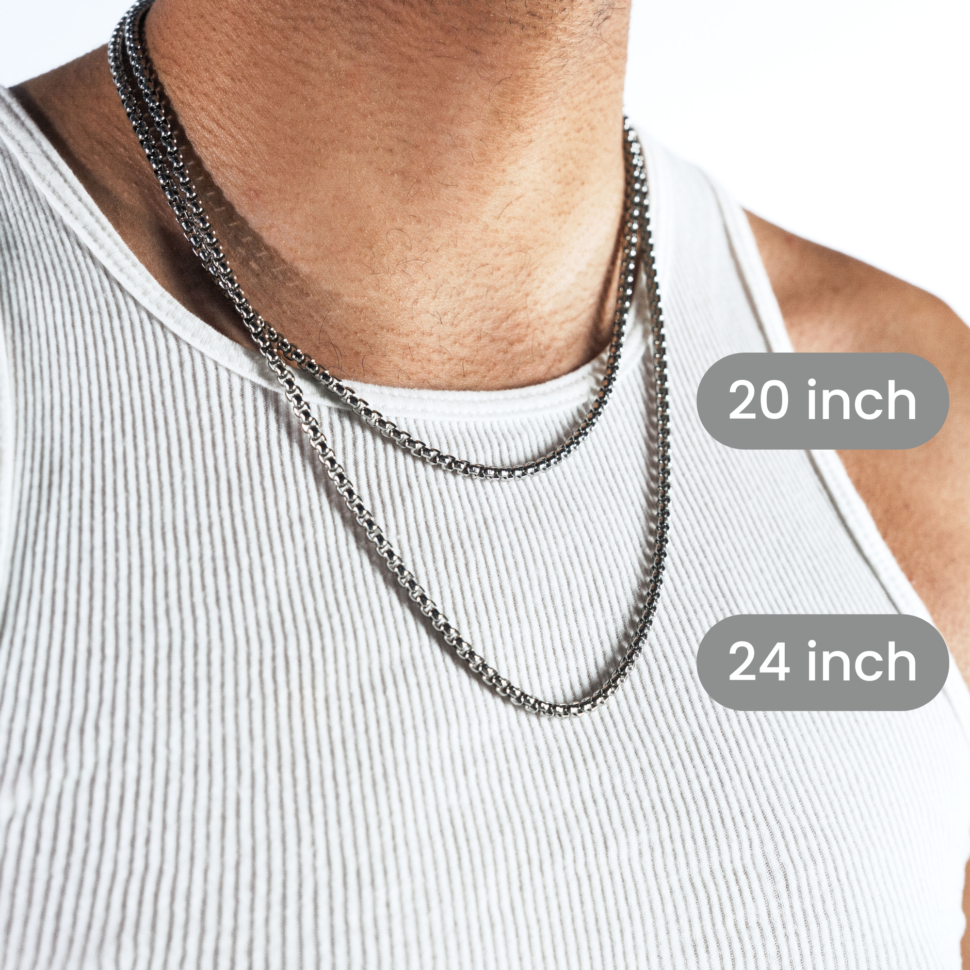A close-up of a man wearing two silver-toned chain necklaces over a white ribbed tank top, with overlaid labels showing 20 inch and 24 inch lengths.