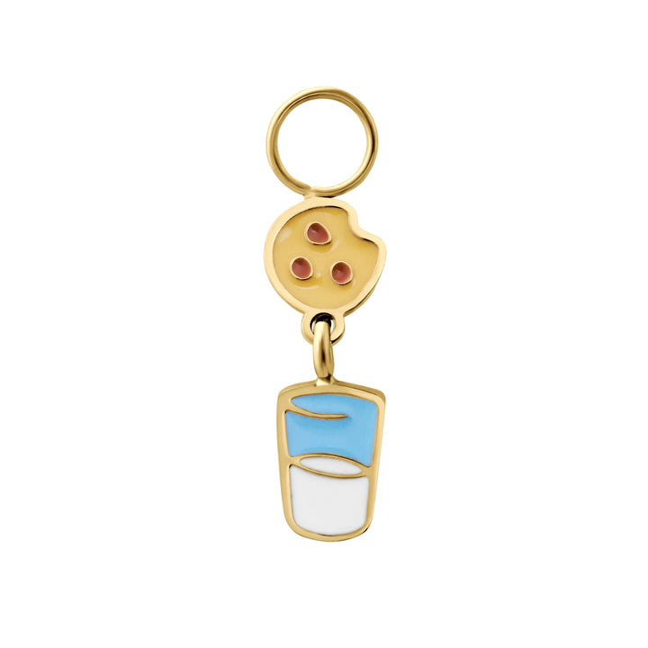 Gold enamel hoop charm resembling a chocolate chip cookie suspended over a cup of milk on a white background